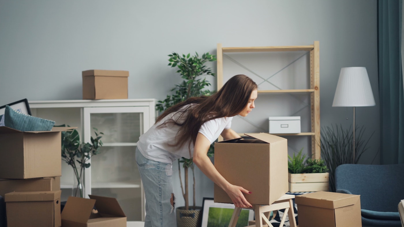 Boxes carefully packed and organized in a bright living room during a move
